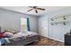 Bedroom features wood floors, large closet and teddy bear on bed at 424 Crystal Spring Dr, Sanford, NC 27332