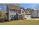Charming two-story home with blue shutters, a well-manicured lawn and a two-car garage at 424 Crystal Spring Dr, Sanford, NC 27332