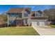 Charming two-story home with blue shutters and a well-manicured lawn showcasing curb appeal at 424 Crystal Spring Dr, Sanford, NC 27332