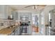 Well-lit kitchen boasts stainless steel appliances, gray cabinetry, and tile flooring at 424 Crystal Spring Dr, Sanford, NC 27332