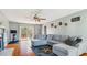 Bright living room with hardwood floors, ceiling fan and sliding glass doors to the deck at 424 Crystal Spring Dr, Sanford, NC 27332