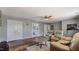 Spacious living room with hardwood floors, comfortable seating, and ceiling fan at 424 Crystal Spring Dr, Sanford, NC 27332