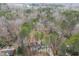 An aerial view of the property reveals a home nestled among mature trees, offering privacy and seclusion at 48 Margaret Pl, Chapel Hill, NC 27516