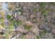 An aerial view showcases the property boundaries of a home nestled among mature trees at 48 Margaret Pl, Chapel Hill, NC 27516