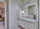 Bright bathroom with marble countertop vanity, stylish mirror, and a view of bedroom at 48 Margaret Pl, Chapel Hill, NC 27516