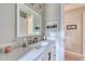 Bright bathroom featuring a quartz vanity top, modern fixtures, and neutral paint at 48 Margaret Pl, Chapel Hill, NC 27516