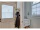 Well-lit bathroom with vanity, mirror, and window with plantation shutters at 48 Margaret Pl, Chapel Hill, NC 27516