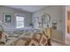 Bright bedroom featuring neutral walls, patterned bedding, and classic decor elements at 48 Margaret Pl, Chapel Hill, NC 27516