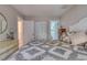 Well-lit bedroom showcasing comfortable bedding, a full closet and entry to the bathroom at 48 Margaret Pl, Chapel Hill, NC 27516