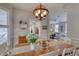Warm dining room featuring a wooden table, chandelier, and seamless flow into the living spaces at 48 Margaret Pl, Chapel Hill, NC 27516