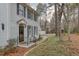 Exterior of a home with dark shutters, black railings, and a quaint stone walkway at 48 Margaret Pl, Chapel Hill, NC 27516