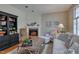 Comfortable living room with fireplace, built-in shelving, hardwood floors and lots of natural light at 48 Margaret Pl, Chapel Hill, NC 27516