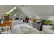 Bright living room with skylight, sofa, desk and charming rug on carpet at 48 Margaret Pl, Chapel Hill, NC 27516