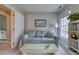 Comfortable living room with a cozy sofa, a decorative coffee table, and bookshelves with lots of books at 48 Margaret Pl, Chapel Hill, NC 27516