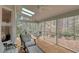 Relaxing screened porch with comfortable seating and a view of the peaceful wooded surroundings at 48 Margaret Pl, Chapel Hill, NC 27516