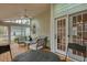 Inviting screened porch featuring a ceiling fan and comfortable outdoor seating area at 48 Margaret Pl, Chapel Hill, NC 27516