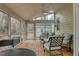 Relaxing screened porch with outdoor seating and views of the backyard and the woods at 48 Margaret Pl, Chapel Hill, NC 27516