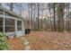 The exterior of a screened porch and a stone path leading to a wooded backyard at 48 Margaret Pl, Chapel Hill, NC 27516