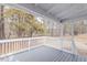 Enjoy the serene backyard view from the back porch with white railings at 4814 Fayetteville Rd, Durham, NC 27713