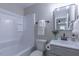 Bathroom with vanity, shower-tub combo, and decorative mirror is move-in ready at 4814 Fayetteville Rd, Durham, NC 27713