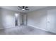 Bedroom boasts neutral carpet, a ceiling fan, and convenient ensuite access at 4814 Fayetteville Rd, Durham, NC 27713