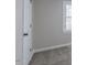 Bright bedroom with cozy carpet, fresh paint, and a large window at 4814 Fayetteville Rd, Durham, NC 27713