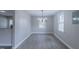 The dining area features modern lighting and bright windows, creating an inviting space at 4814 Fayetteville Rd, Durham, NC 27713