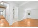Bright bedroom featuring hardwood floors, neutral walls, and an ensuite bathroom with a glass door shower at 492 Pixley Pritchard Rd, Timberlake, NC 27583