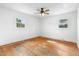 Sunlit bedroom featuring hardwood floors and two windows at 492 Pixley Pritchard Rd, Timberlake, NC 27583