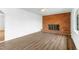 Bright living room featuring hardwood floors and a classic brick fireplace at 492 Pixley Pritchard Rd, Timberlake, NC 27583