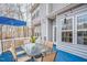 Spacious back deck featuring a dining table and blue umbrella, ideal for outdoor gatherings at 507 Town Crier Ct, Hillsborough, NC 27278