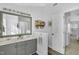 Bright bathroom with double vanity, modern mirror, and a convenient linen closet at 507 Town Crier Ct, Hillsborough, NC 27278