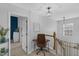 Second-floor hallway with a desk and a view of a blue accent wall in an adjacent room at 507 Town Crier Ct, Hillsborough, NC 27278