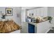 Bright kitchen with white cabinets, blue island, stainless steel appliances, and attractive countertops at 507 Town Crier Ct, Hillsborough, NC 27278