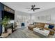 Open living space featuring a fireplace, large windows, a leather sofa, and stylish decor at 507 Town Crier Ct, Hillsborough, NC 27278
