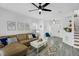 Spacious living room showcasing a comfortable leather sofa, stylish decor, and a view of the home's entrance at 507 Town Crier Ct, Hillsborough, NC 27278