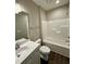 Clean bathroom with tub, white vanity, modern sink and faucet, and neutral walls at 512 Hicksmill Rd, Oxford, NC 27565