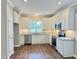 Modern kitchen with stainless steel appliances, granite countertops, and white cabinetry at 512 Hicksmill Rd, Oxford, NC 27565