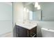 Bathroom has updated lighting and quartz countertops at 515 N Mangum St # 14, Durham, NC 27701