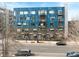 Modern building with a blue facade, featuring multiple windows and private balconies at 515 N Mangum St # 14, Durham, NC 27701