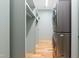 The laundry room offers a sleek stacked washer/dryer and spacious shelving at 515 N Mangum St # 14, Durham, NC 27701