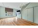 Contemporary living room featuring a modern light fixture, hardwood flooring, and a sliding barn door at 515 N Mangum St # 14, Durham, NC 27701