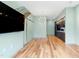 Open-concept living space featuring hardwood floors connecting the living room to the modern kitchen at 515 N Mangum St # 14, Durham, NC 27701