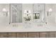Bright bathroom showcasing double vanity with two sinks, mirrors, and a light neutral color palette at 5213 Bent Leaf Dr, Raleigh, NC 27606