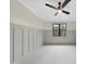 Cozy bedroom featuring a modern ceiling fan, neutral colors, and a large window at 5213 Bent Leaf Dr, Raleigh, NC 27606
