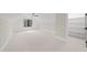 Attic bedroom with neutral walls, a black trimmed window, and view into a closet with shelving at 5213 Bent Leaf Dr, Raleigh, NC 27606