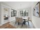 Bright dining room featuring a neutral color palette and large windows at 5213 Bent Leaf Dr, Raleigh, NC 27606