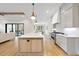 Bright, open kitchen with a large island and stainless steel appliances at 5213 Bent Leaf Dr, Raleigh, NC 27606
