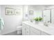 Bright bathroom with a white dual sink vanity with a large mirror and a tile shower at 529 Freedom Trail Dr, Willow Springs, NC 27592