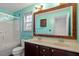 Bathroom with a large mirror, double sinks, and a shower at 5321 Cog Hill Ct, Raleigh, NC 27604